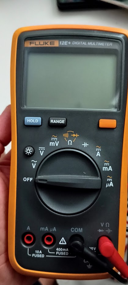 Fluke 12E+ digital multimeter with probes connected